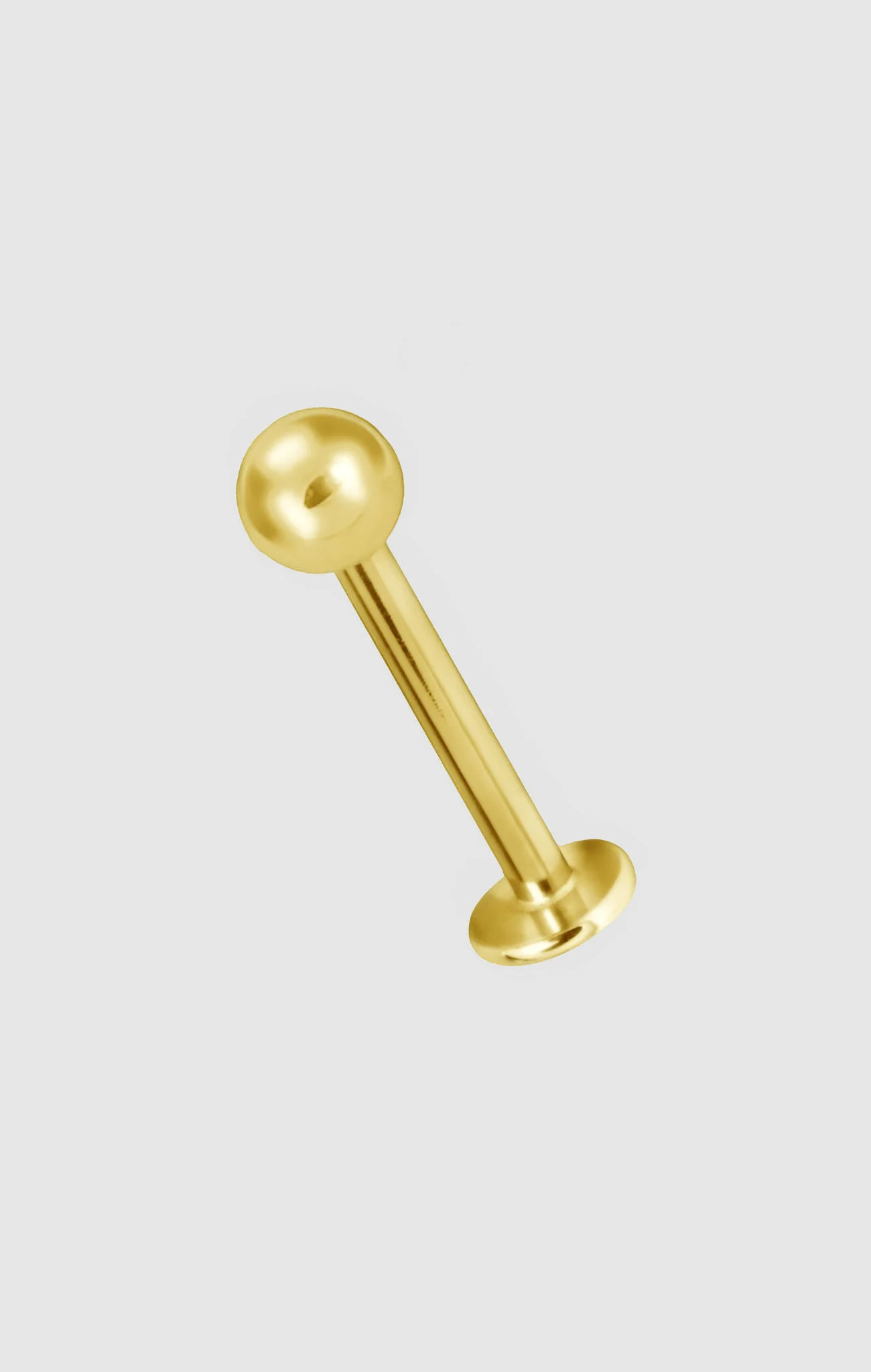 Glow Bolt titanium facial pin with minimalist spherical head design and gold PVD coating, suitable for initial or upgraded piercings.
