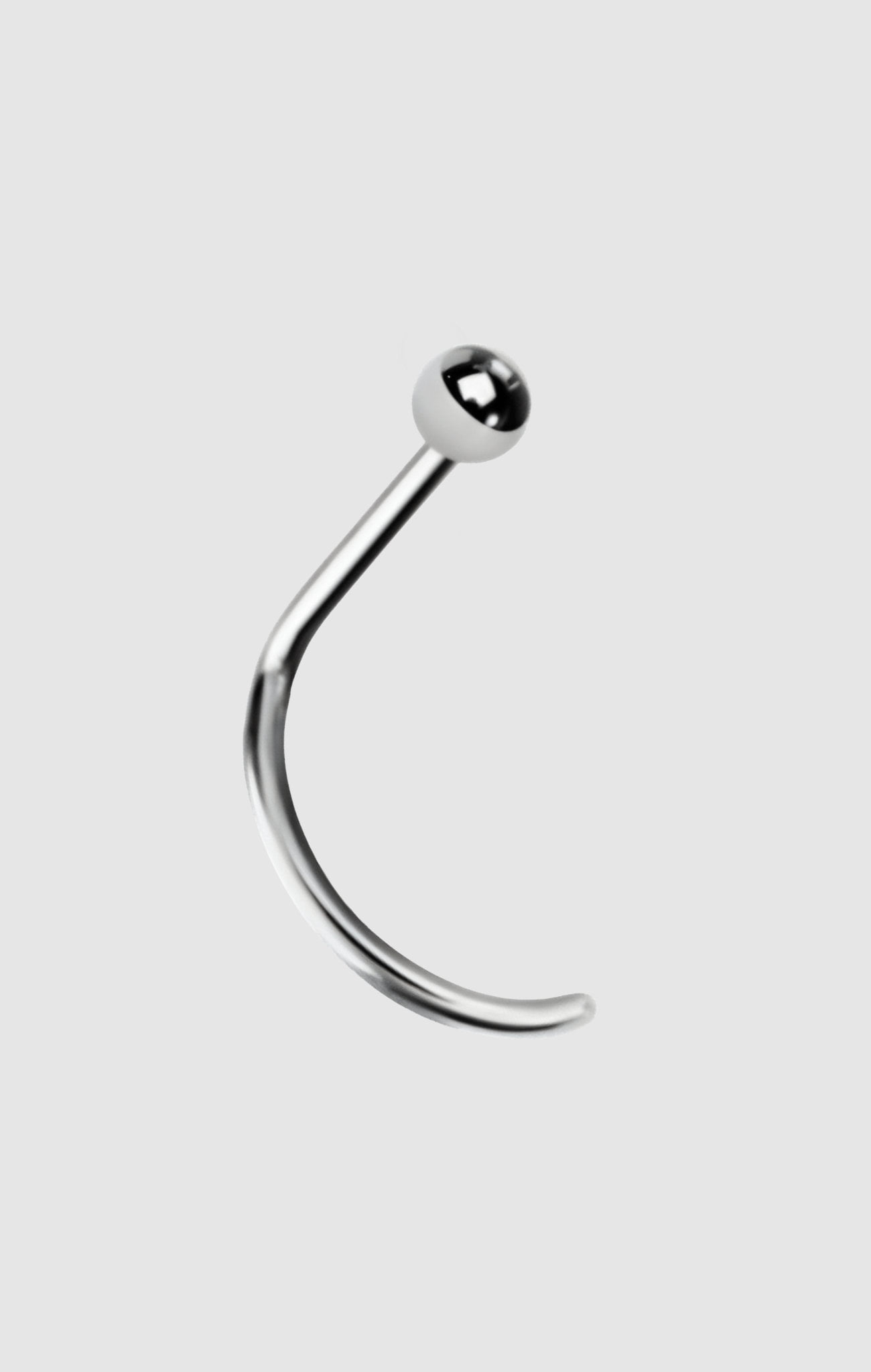 The Point titanium nose stud available in silver and gold, suitable for initial nostril piercings.